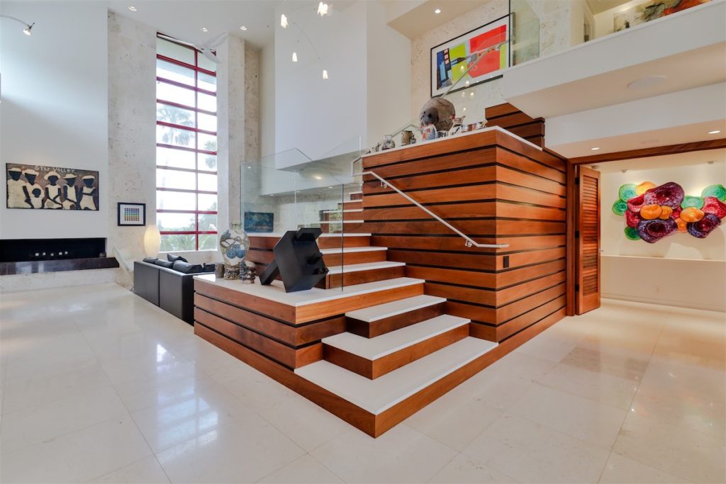 Custom limestone staircase with steel/glass railing